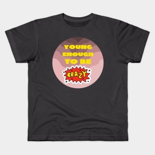 Young enough to be crazy Kids T-Shirt